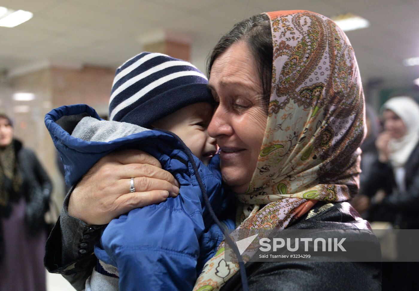 Welcoming Russian children, rescued in Syria, at Grozny Airport