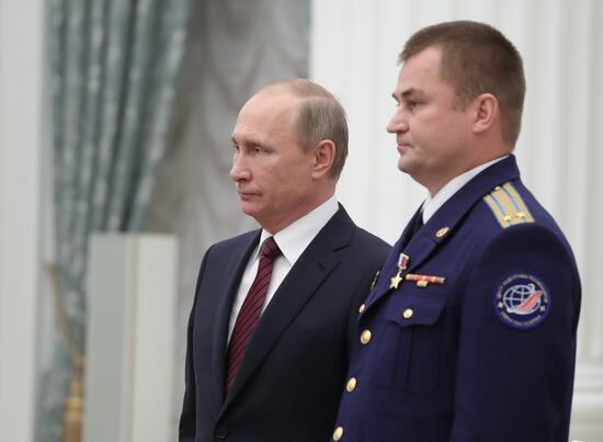 President Vladimir Putin presents state decorations at Kremlin