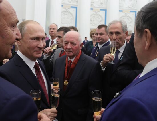 President Vladimir Putin presents state decorations at Kremlin