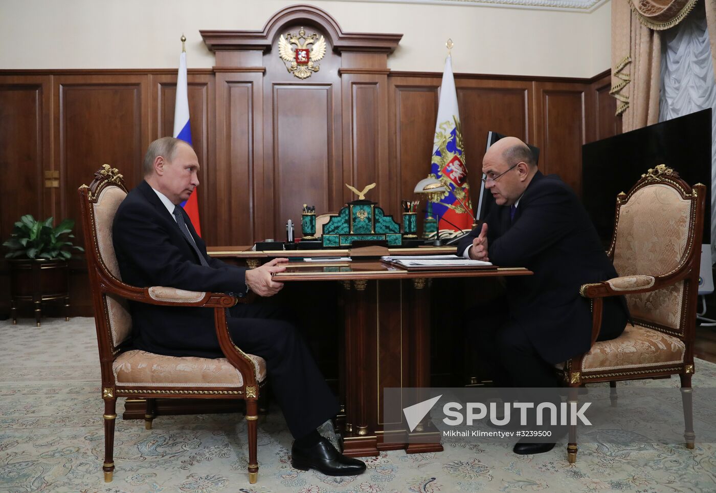 Russian President Vladimir Putin meets with FTS Head Mikhail Mishustin