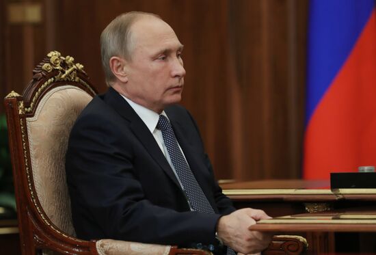 Russian President Vladimir Putin meets with FTS Head Mikhail Mishustin
