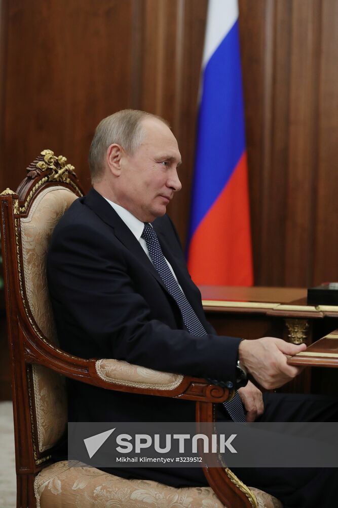 Russian President Vladimir Putin meets with FTS Head Mikhail Mishustin