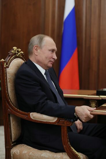 Russian President Vladimir Putin meets with FTS Head Mikhail Mishustin