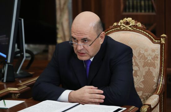 Russian President Vladimir Putin meets with FTS Head Mikhail Mishustin