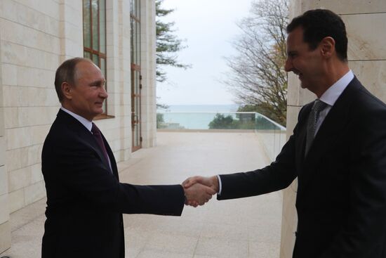 Vladimir Putin meets with Syrian President Bashar Al-Assad