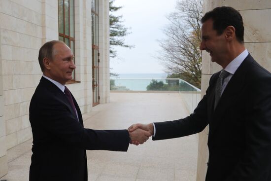 Vladimir Putin meets with Syrian President Bashar Al-Assad