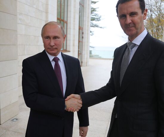 Vladimir Putin meets with Syrian President Bashar Al-Assad
