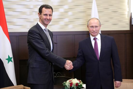 Vladimir Putin meets with Syrian President Bashar Al-Assad