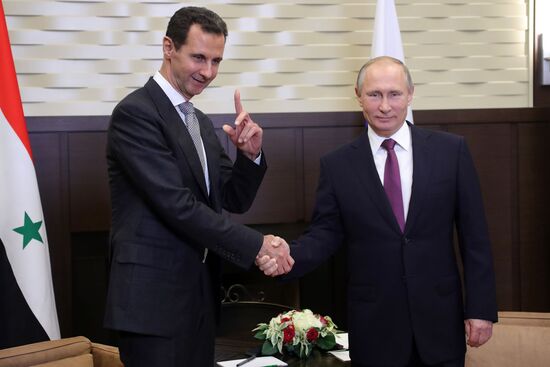 Vladimir Putin meets with Syrian President Bashar Al-Assad