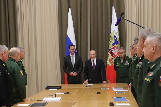 Vladimir Putin meets with Syrian President Bashar Al-Assad