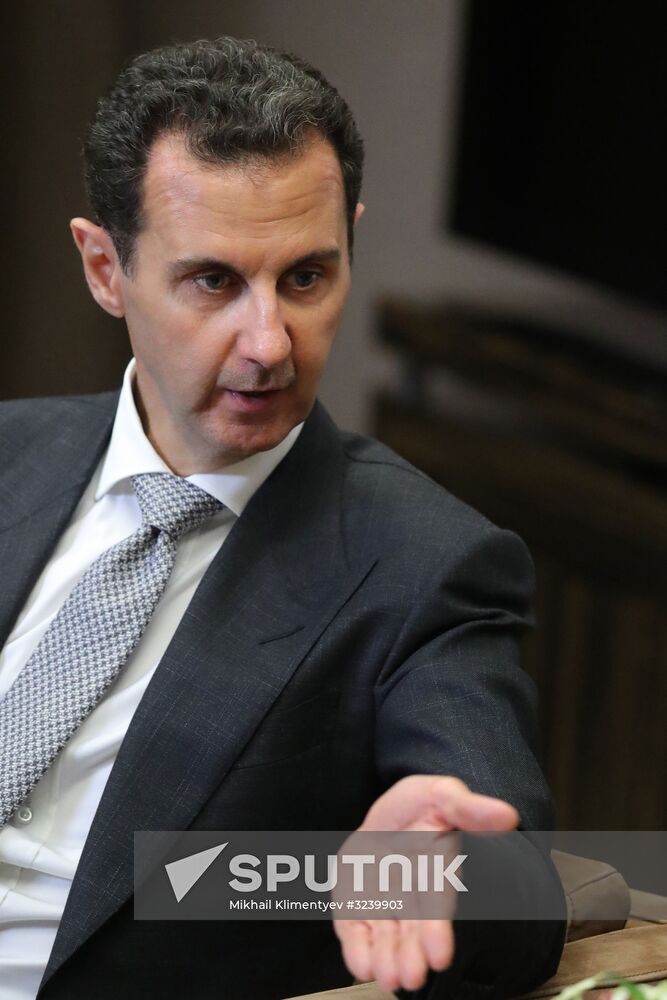 Vladimir Putin meets with Syrian President Bashar Al-Assad