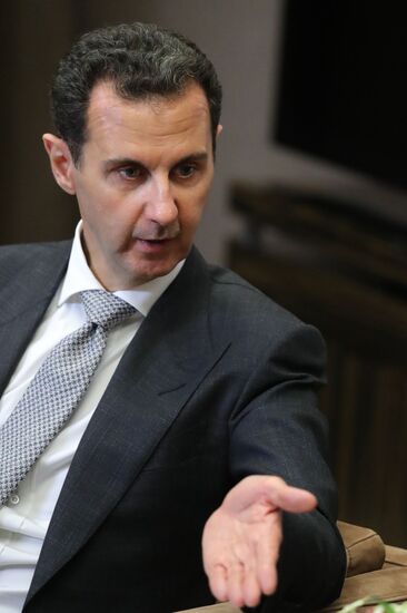 Vladimir Putin meets with Syrian President Bashar Al-Assad