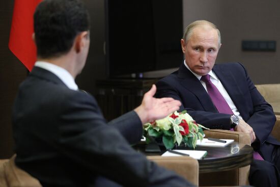 Vladimir Putin meets with Syrian President Bashar Al-Assad