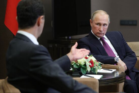 Vladimir Putin meets with Syrian President Bashar Al-Assad