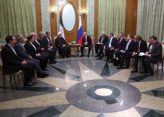 Russian President Vladimir Putin meets with Iranian President Hassan Rouhani