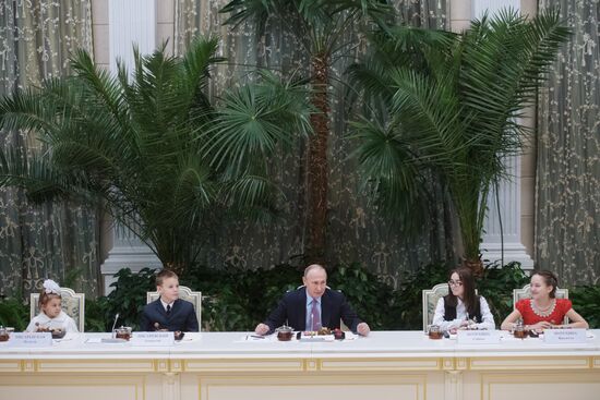 Russian President Vladimir Putin meets with winners of Family of the Year national contest