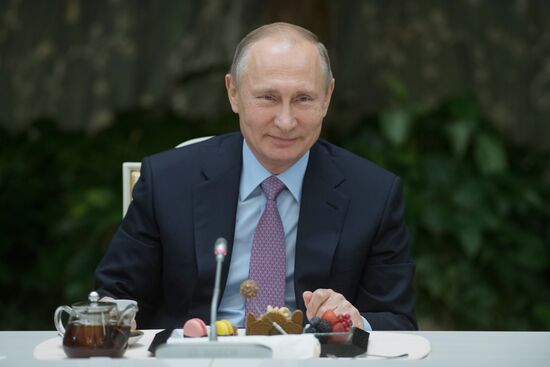 Russian President Vladimir Putin meets with winners of Family of the Year national contest