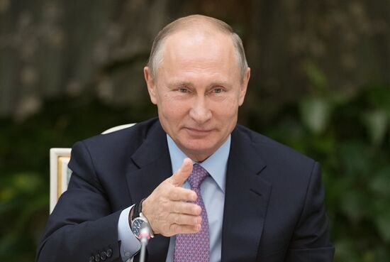 Russian President Vladimir Putin meets with winners of Family of the Year national contest
