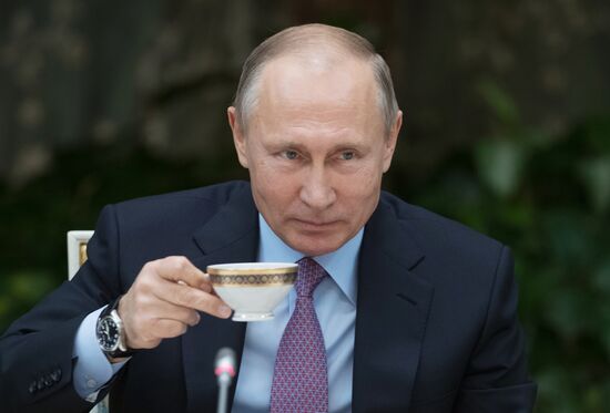 Russian President Vladimir Putin meets with winners of Family of the Year national contest