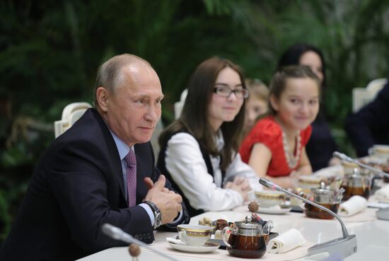 Russian President Vladimir Putin meets with winners of Family of the Year national contest