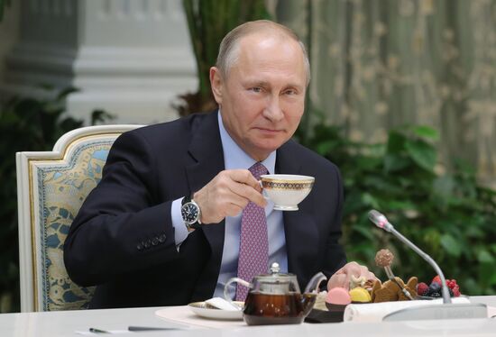 Russian President Vladimir Putin meets with winners of Family of the Year national contest