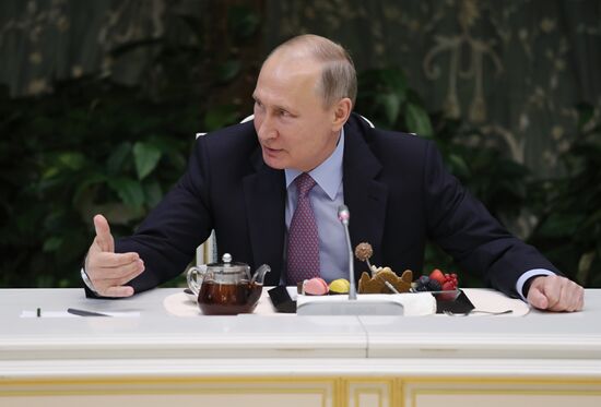 Russian President Vladimir Putin meets with winners of Family of the Year national contest