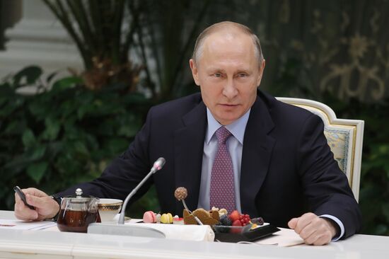 Russian President Vladimir Putin meets with winners of Family of the Year national contest