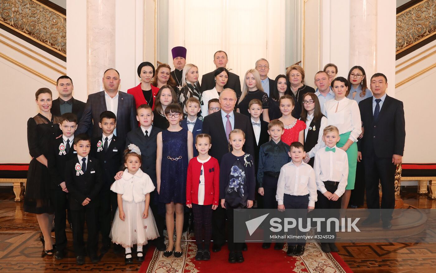 Russian President Vladimir Putin meets with winners of Family of the Year national contest