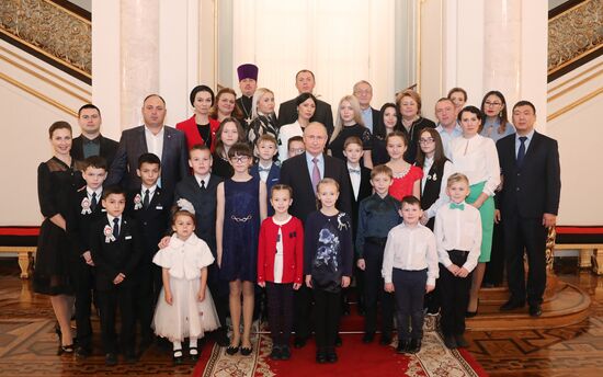 Russian President Vladimir Putin meets with winners of Family of the Year national contest