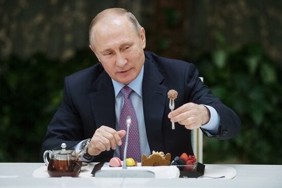Russian President Vladimir Putin meets with winners of Family of the Year national contest