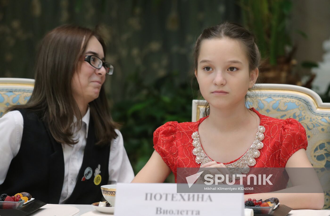 Russian President Vladimir Putin meets with winners of Family of the Year national contest