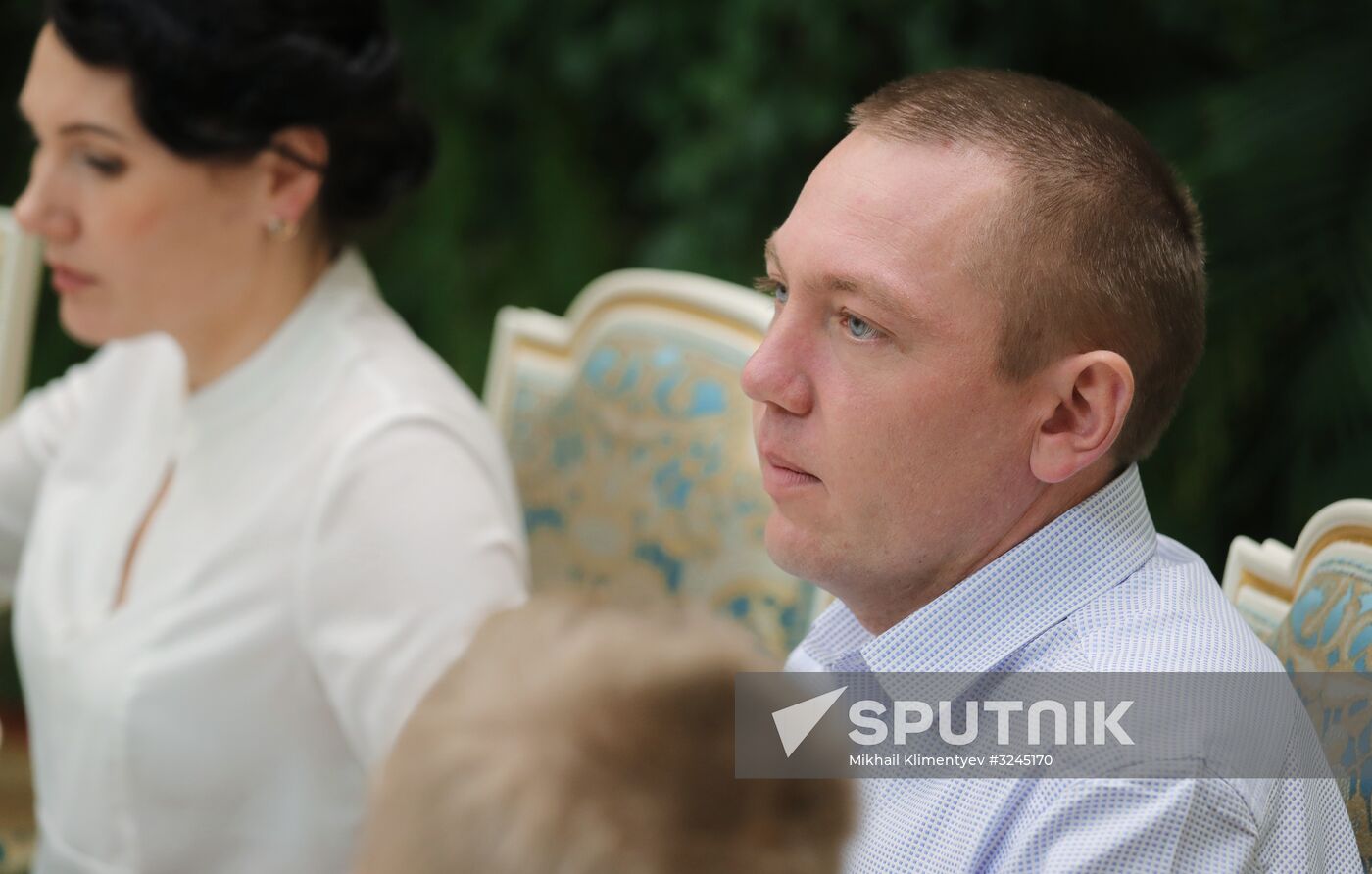 Russian President Vladimir Putin meets with winners of Family of the Year national contest