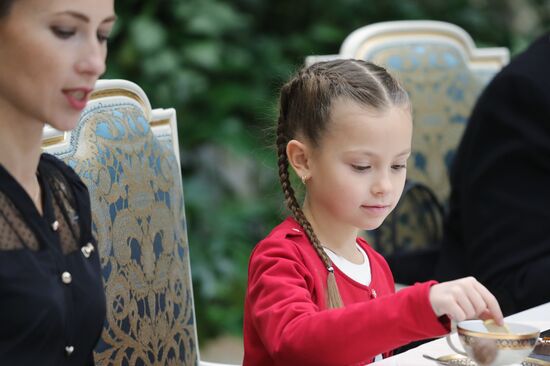 Russian President Vladimir Putin meets with winners of Family of the Year national contest