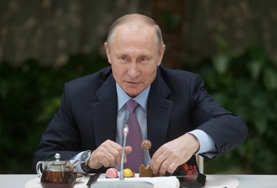 Russian President Vladimir Putin meets with winners of Family of the Year national contest
