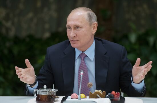 Russian President Vladimir Putin meets with winners of Family of the Year national contest