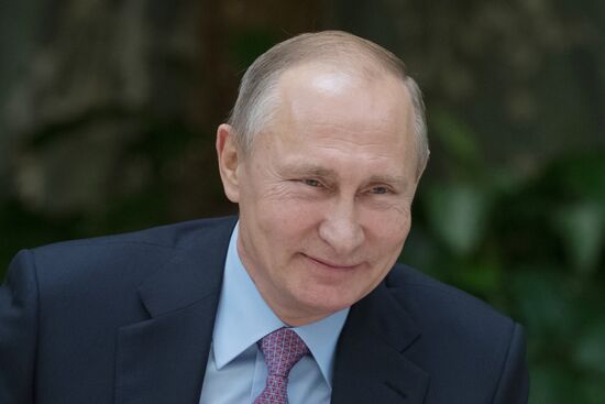 Russian President Vladimir Putin meets with winners of Family of the Year national contest