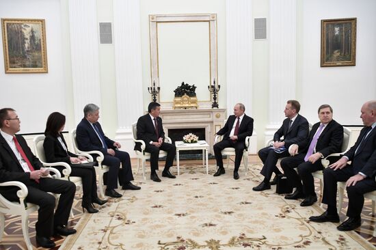 Russian President Vladimir Putin meets with Kyrgyz President Sooronbay Jeenbekov