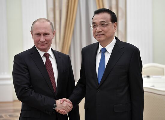 Russian President Vladimir Putin meets with Premier of People's Republic of China Li Keqiang