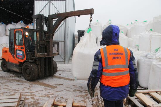 Treating roads with anti-icing materials