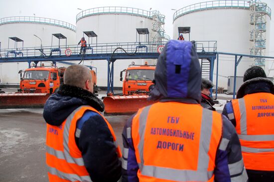 Treating roads with anti-icing materials