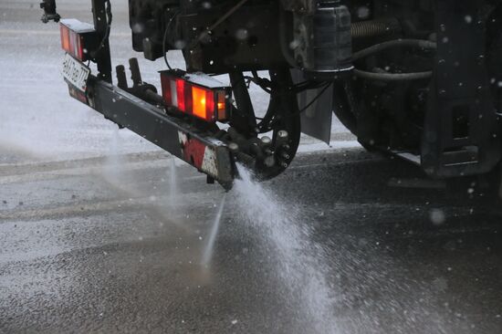 Treating roads with anti-icing materials