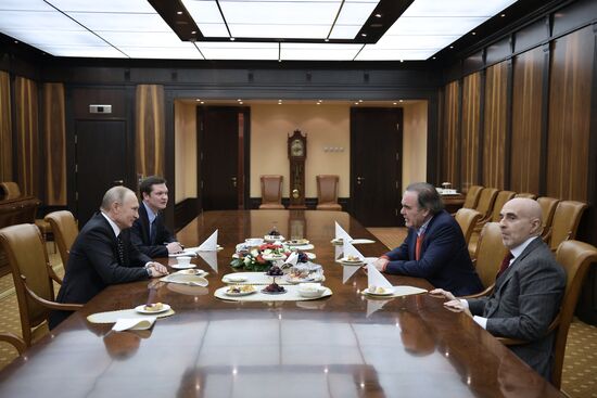 President Vladimir Putin meets with film director Oliver Stone