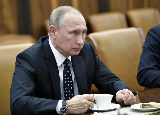 President Vladimir Putin meets with film director Oliver Stone