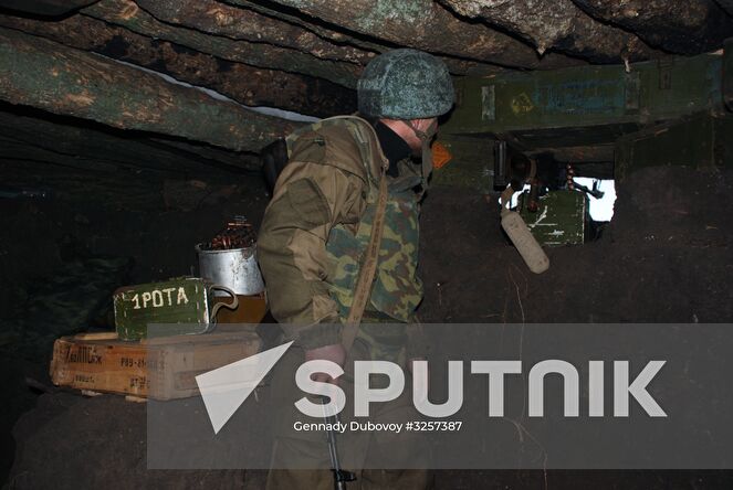 Donetsk People's Republic militia man of 1st company of the infantry battalion, 9th regiment of DPR Armed Forces Marine corps at the contact line with Ukrainian forces near Shirokino village. Location: Ukraine, Donetsk region. Author: Gennady Dubovoy/Sputnik. Donetsk People's Republic contact line sitrep