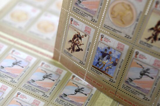 Four postage stamps featuring football in art are put in circulation