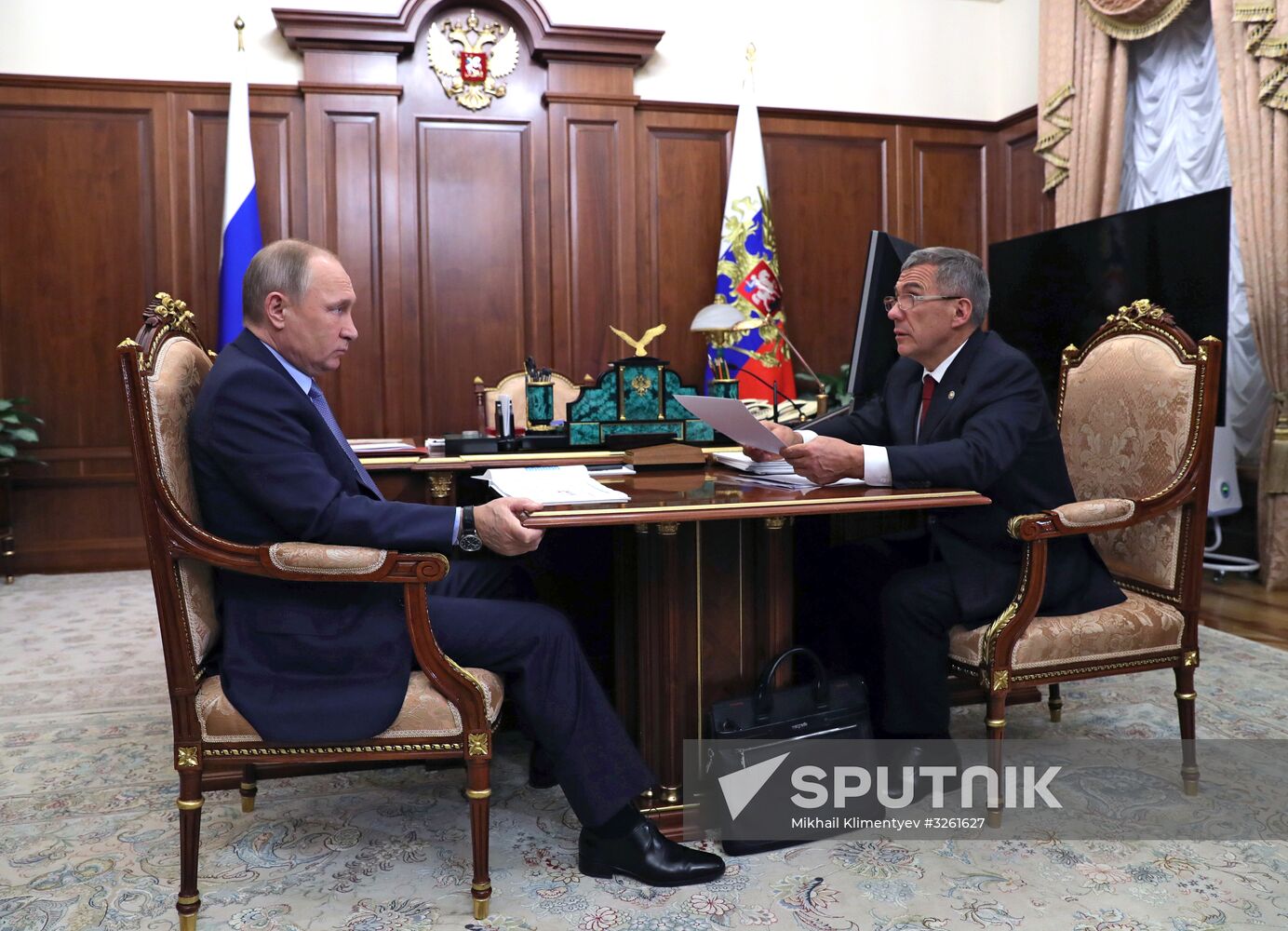 Russian President Vladimir Putin meets with President of Tatarstan Rustam Minnikhanov