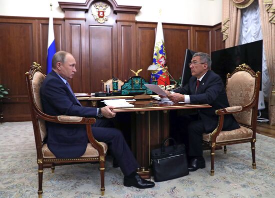 Russian President Vladimir Putin meets with President of Tatarstan Rustam Minnikhanov