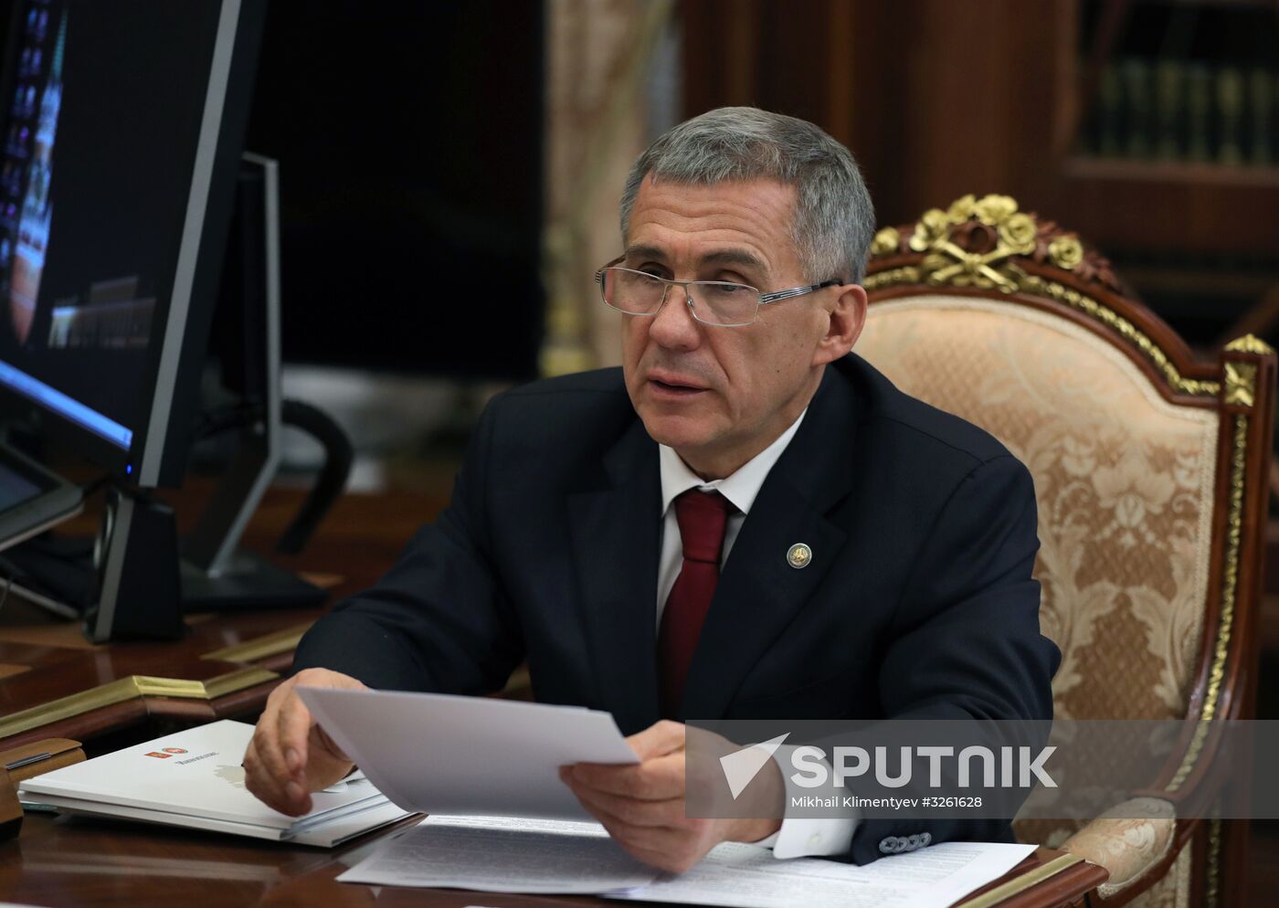 Russian President Vladimir Putin meets with President of Tatarstan Rustam Minnikhanov