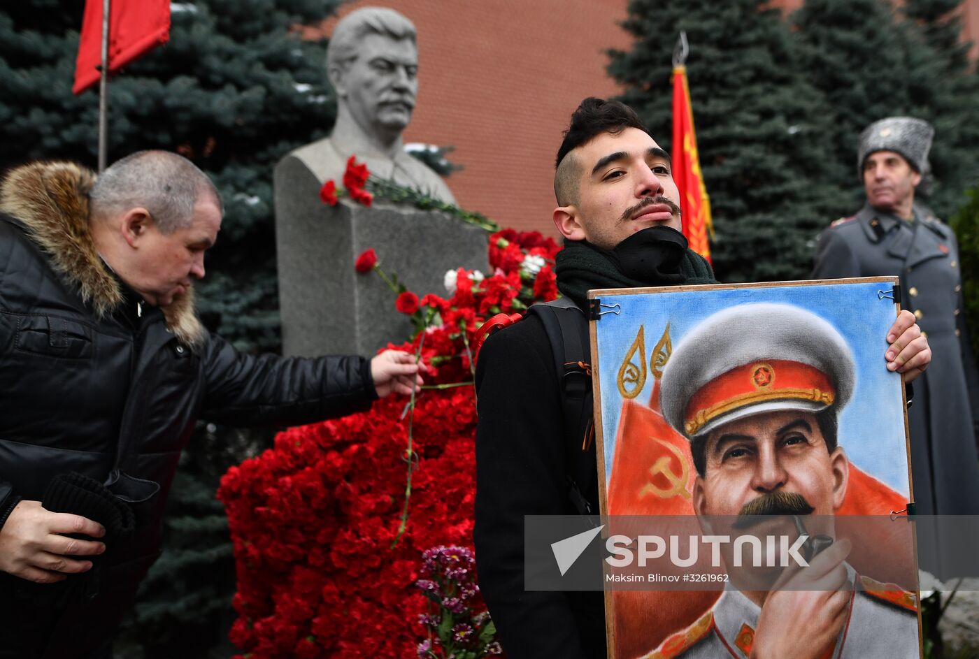 Laying flowers at Joseph Stalin and Felix Dzerzhinsky's graves near Kremlin Wall