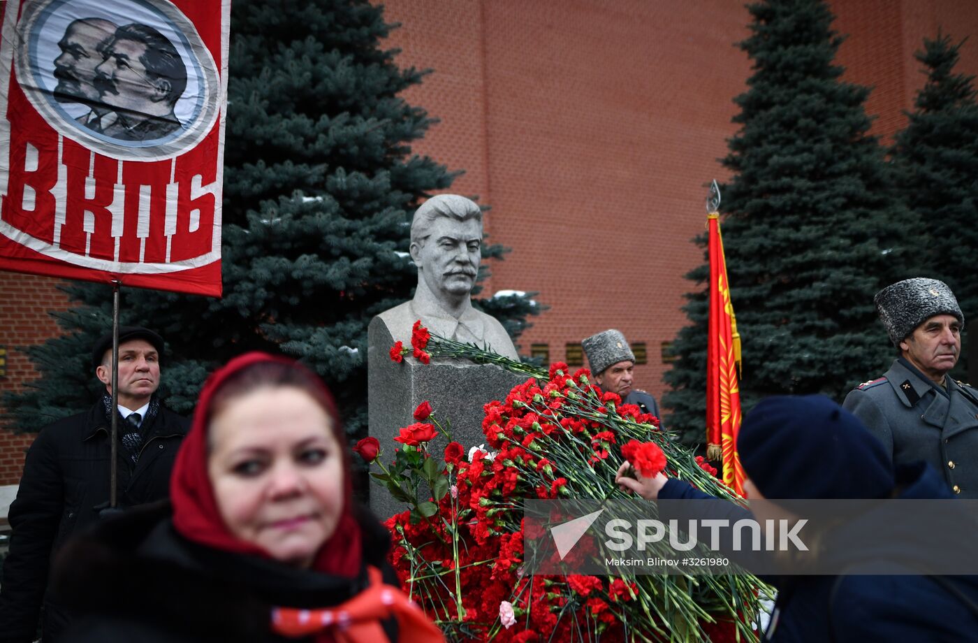 Laying flowers at Joseph Stalin and Felix Dzerzhinsky's graves near Kremlin Wall